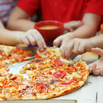 Photo of hands grabbing at pizza