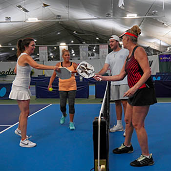 Image of adults on a pickleball court